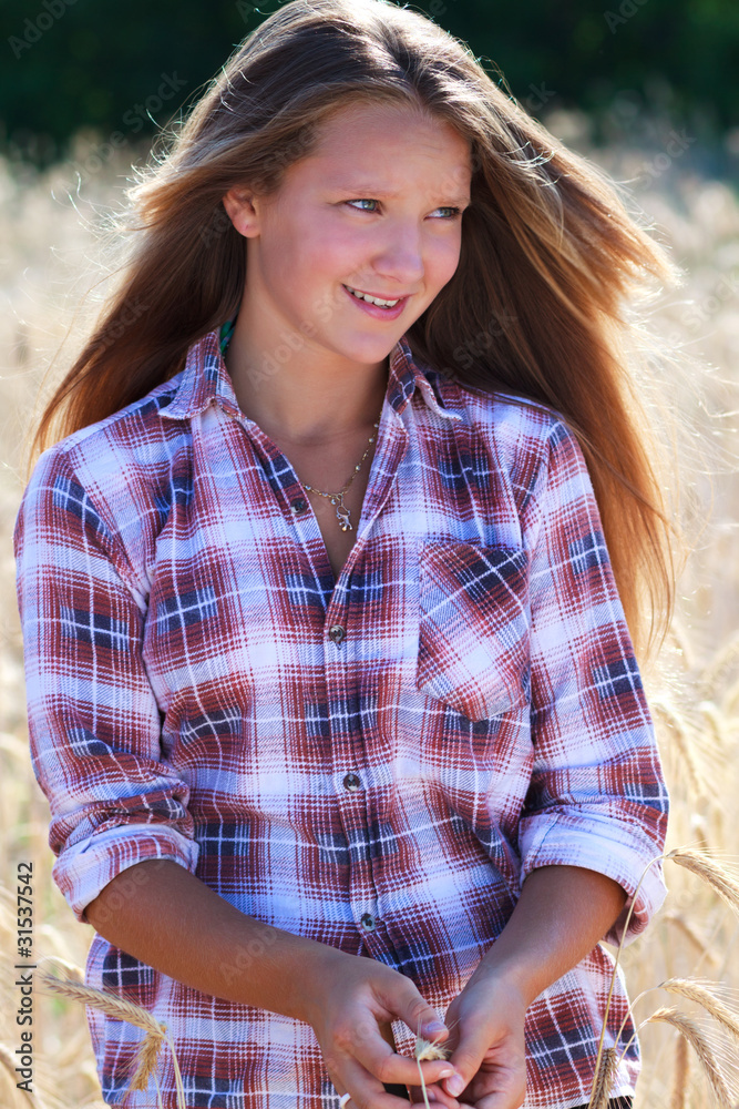 Fototapeta premium Farmer's Daughter in a Field
