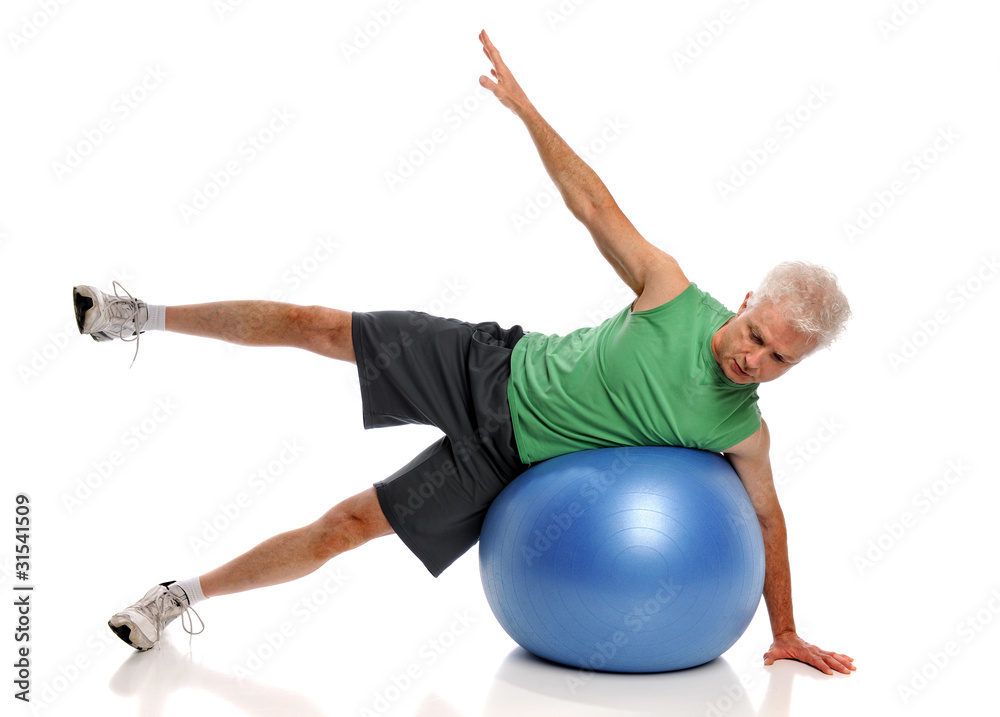 Obraz premium Mature Man Exercising With Fitness Ball
