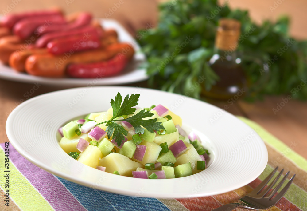 Fresh potato salad with cucumber, red and green onion Fresh potato salad with cucumber, red and green onion