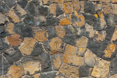 traditional wall of volcanic stones at Jeju island Korea photo