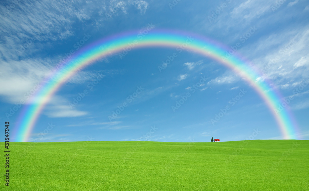Green grass and red roof house and rainbow Green grass and red roof house and rainbow