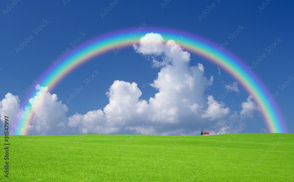 Green grass and red roof house and rainbow Green grass and red roof house and rainbow