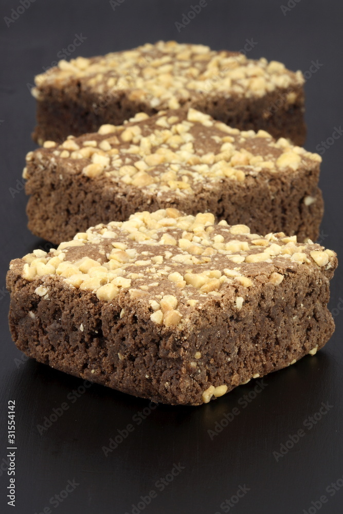 chocolate brownies with cracked peanuts on top chocolate brownies with cracked peanuts on top