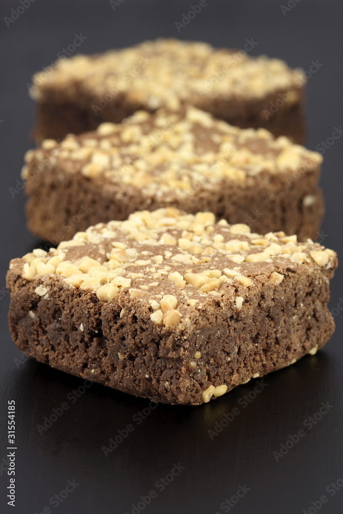 chocolate brownies with cracked peanuts on top chocolate brownies with cracked peanuts on top