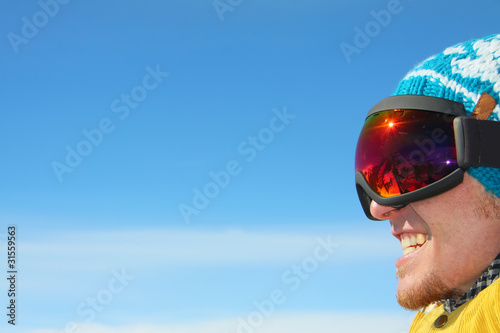 portrait of a smiling snowboarder © joppo