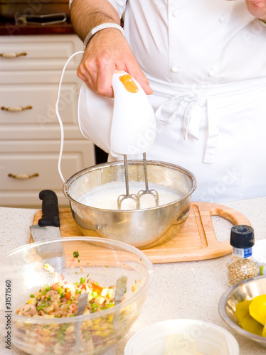 professional chef hands with mixer