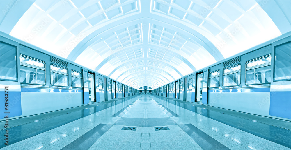 symmetric illuminated metro station with marble floor