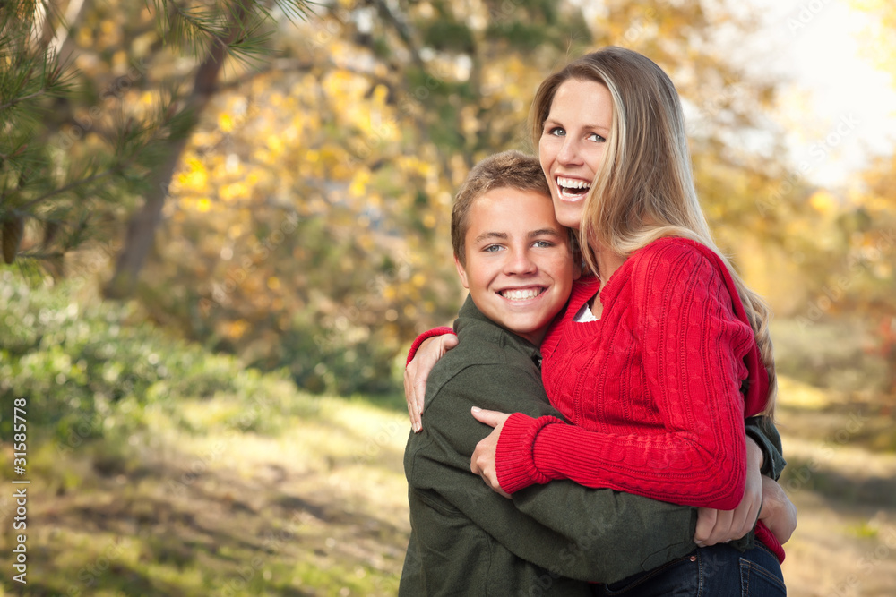 Playful Mother and Son Pose for a Portrait Outdoors Playful Mother and Son Pose for a Portrait Outdoors