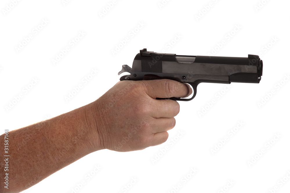 handgun cocked in a hand isolated on white handgun cocked in a hand isolated on white