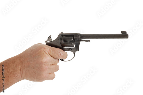 handgun cocked in a hand isolated on white