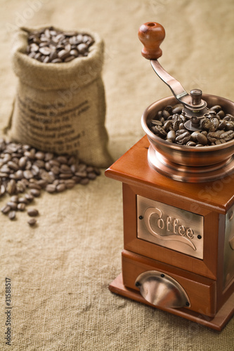 coffee beans in bag and coffee grinder
