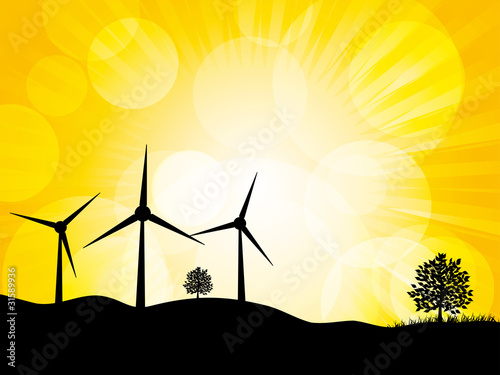 Wind turbines on a mountain with yellow sky