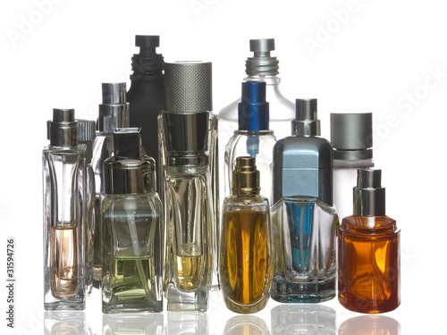 Colorful perfume bottles with reflection