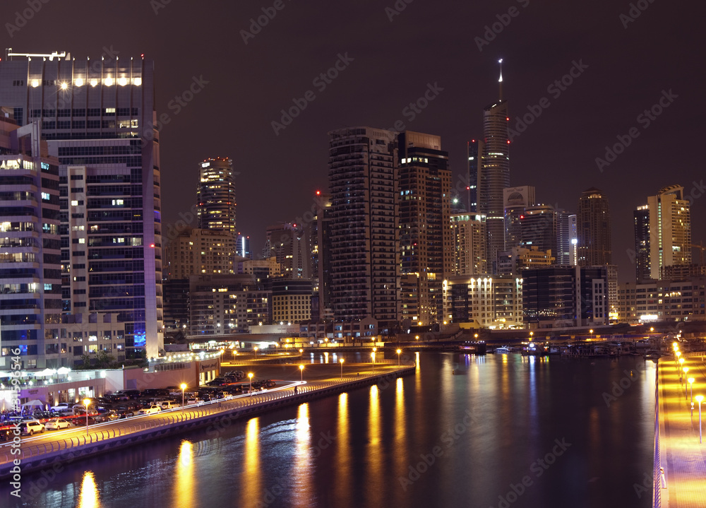 Town scape at night time. Panoramic scene, Dubai.