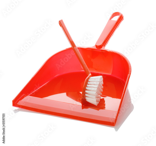 isolated red plastic dustpan with brush