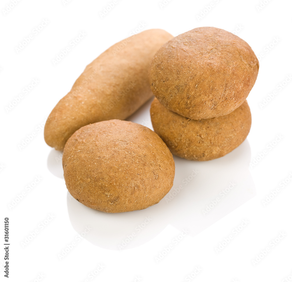 one long and three round loafs of bread one long and three round loafs of bread