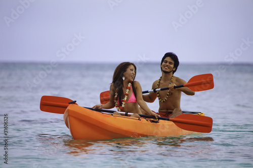 young asian couple in their kayak in hawaii © tomas del amo