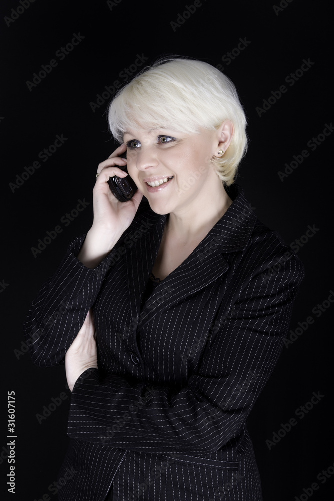 Attractive business woman talking on mobile phone Attractive business woman talking on mobile phone