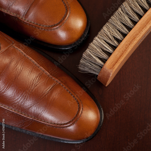 Light brown shoes and brush
