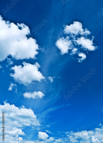 sparce clouds on blue heaven photo