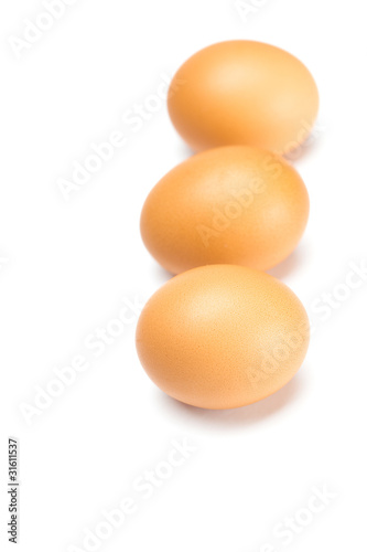 Three large eggs isolated on white