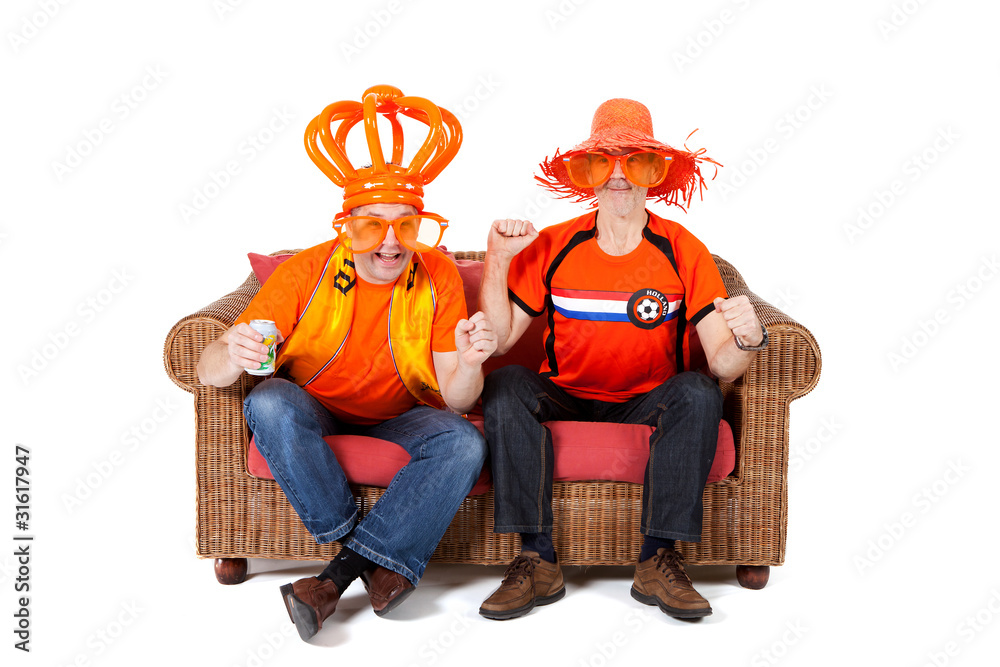 Two Dutch soccer fan watching game over white background