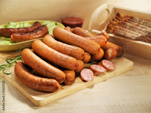 Grilled sausage with bread, cucumber and tomato ketchup