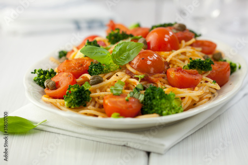 Spaghetti with cherry tomatoes,broccoli and capers