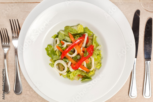 Vegetable salad with calamari