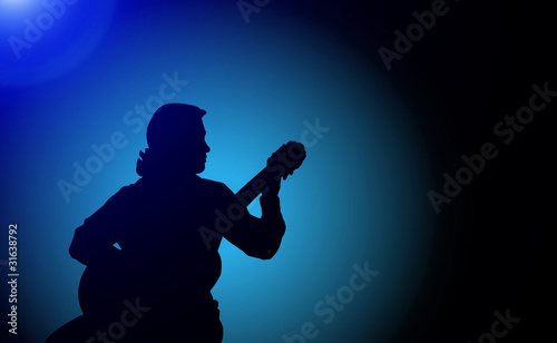 Man playing the guitar - silhouette