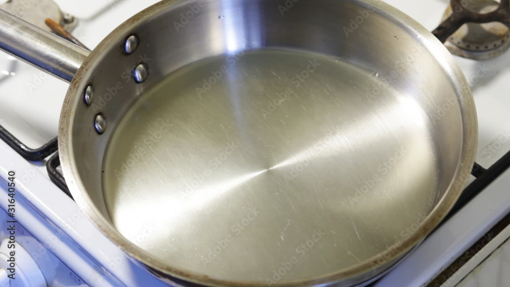 fry an egg on a frying pan - quick motion fry an egg on a frying pan - quick motion