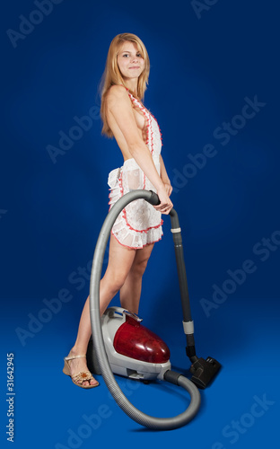 Sexy maid with vacuum cleaner photo