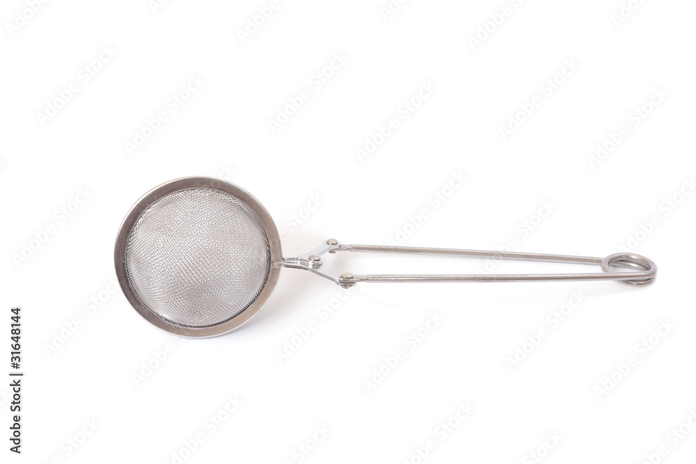 Tea strainer with tea inside isolated on white. Tea strainer with tea inside isolated on white.