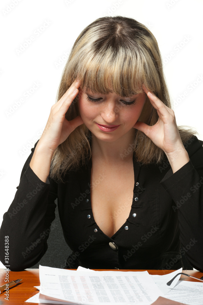 Headache. The business woman on the workplace tired of work Headache. The business woman on the workplace tired of work