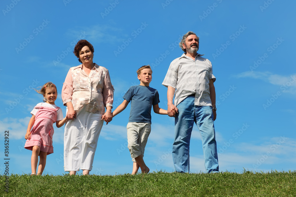 grandfather and grandmother standing on green lawn grandfather and grandmother standing on green lawn