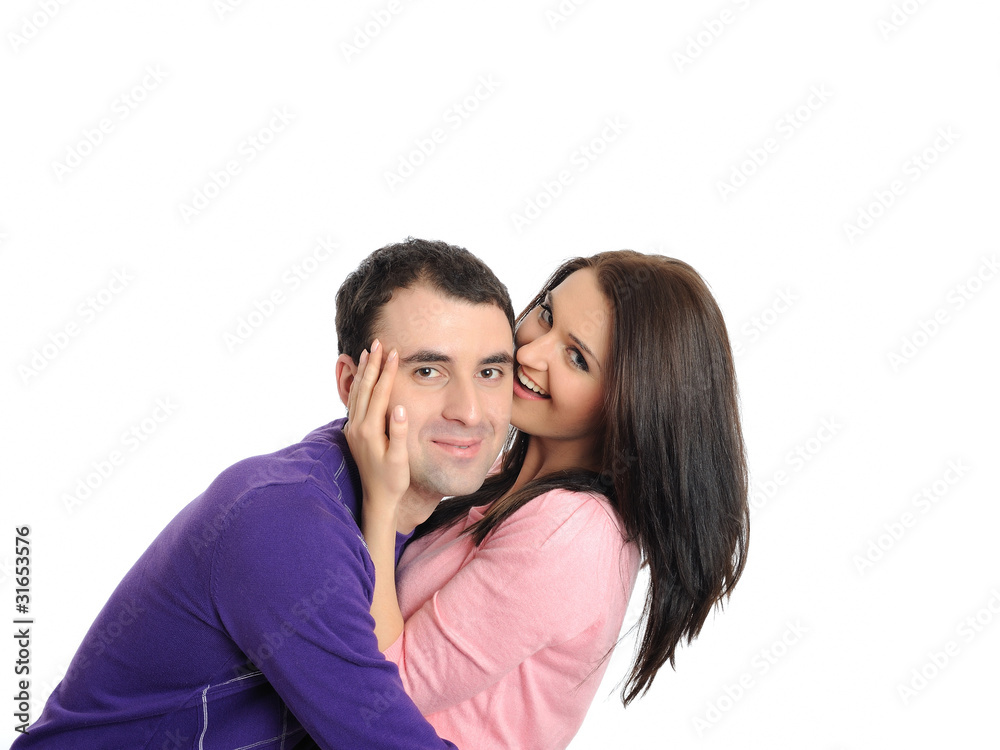 Lovely young couple having fun and smiling. isolated Lovely young couple having fun and smiling. isolated