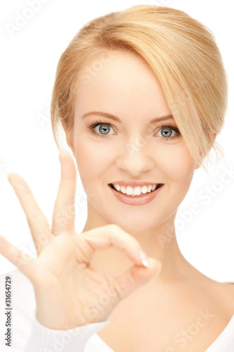 lovely teenage girl showing ok sign
