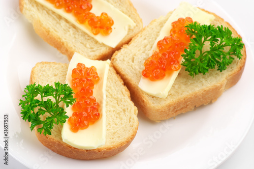 Canapes with salmon caviar