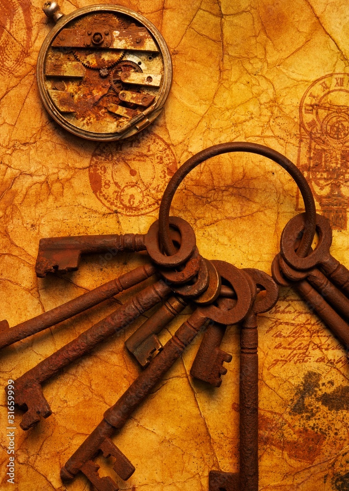 Fototapeta premium Bunch of keys with a gears on the old textured paper