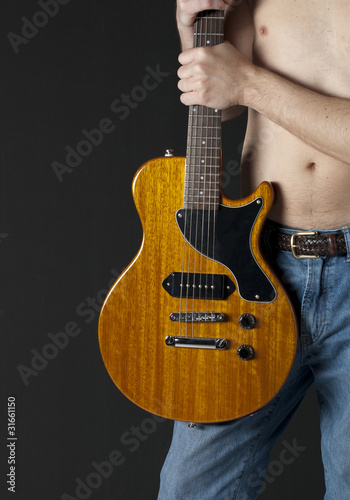 Man holding electric guitar