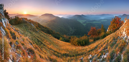 Fototapeta Naklejka Na Ścianę i Meble -  Beautiful sunrise in mountain valley with sun