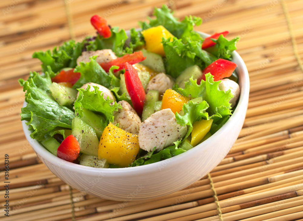 Chicken salad with lettuce, mango, bell pepper and cucumber Chicken salad with lettuce, mango, bell pepper and cucumber