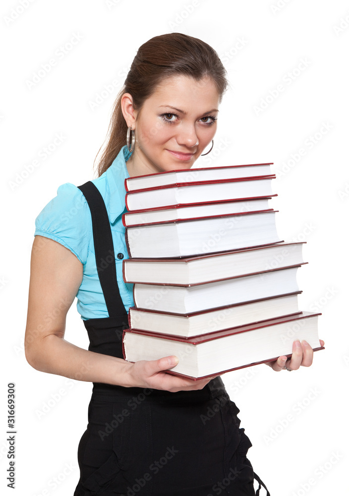 Beautiful student is holding a lot of books Beautiful student is holding a lot of books