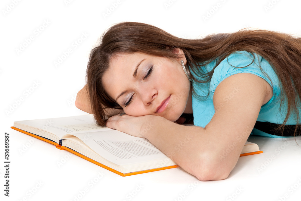 Beautiful student is sleeping on the book Beautiful student is sleeping on the book
