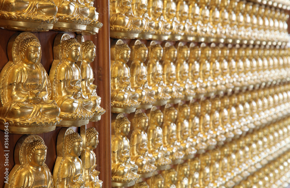 perspective of thousand buddha wall in dragon temple Thailand