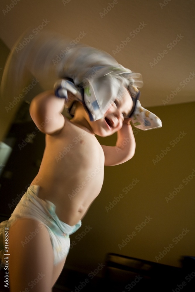 Child Playing With Pajamas