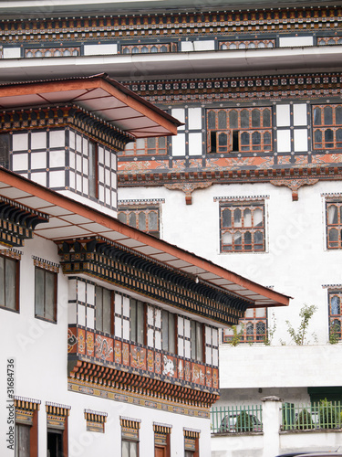 Traditional architecture of Bhutanese houses, Thimphu - Bhutan photo