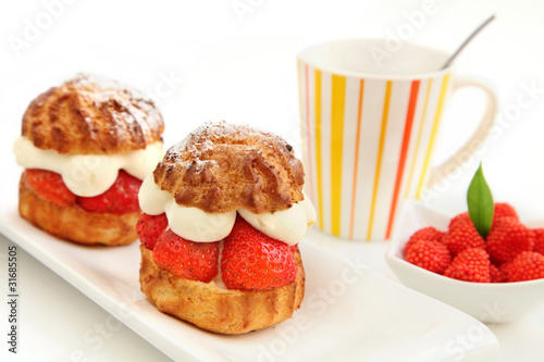Strawberry pastry and cup of coffee