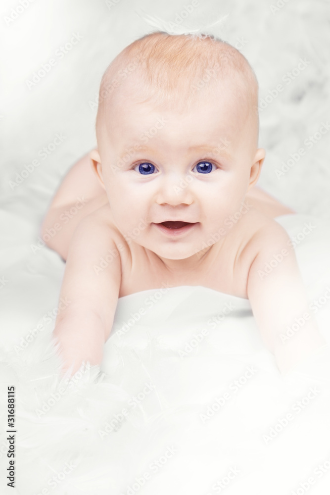 Portrait of happy baby with feather on white background Portrait of happy baby with feather on white background