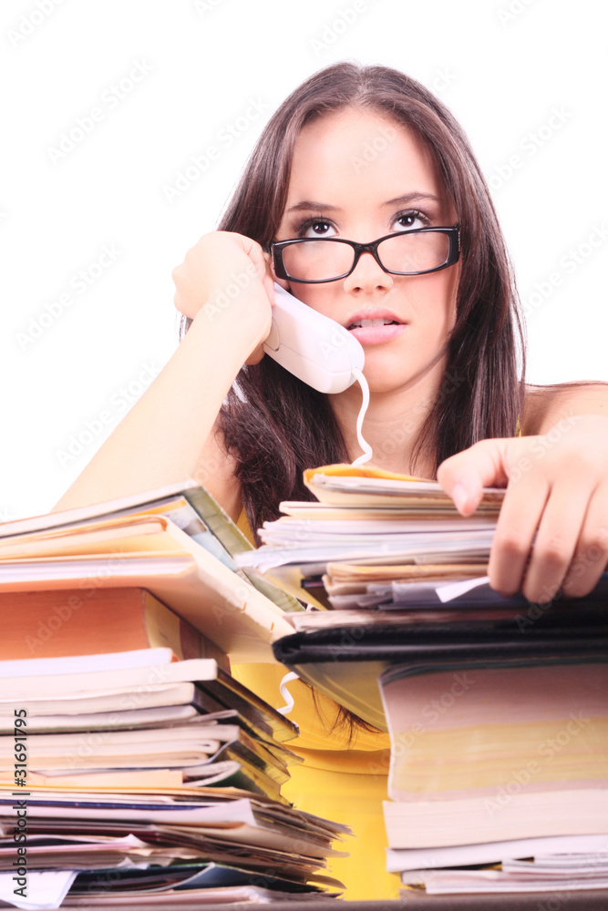 Stressed woman in phone sitting at desk overload Stressed woman in phone sitting at desk overload